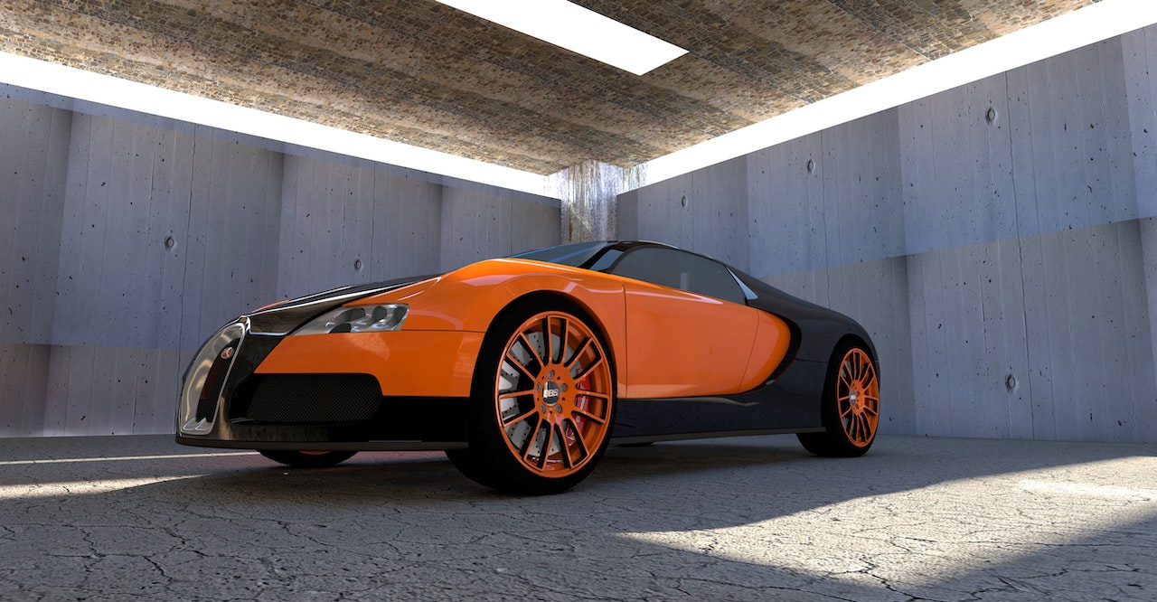 wiata garażowa z pomarańczowym samochodem wewnątrz